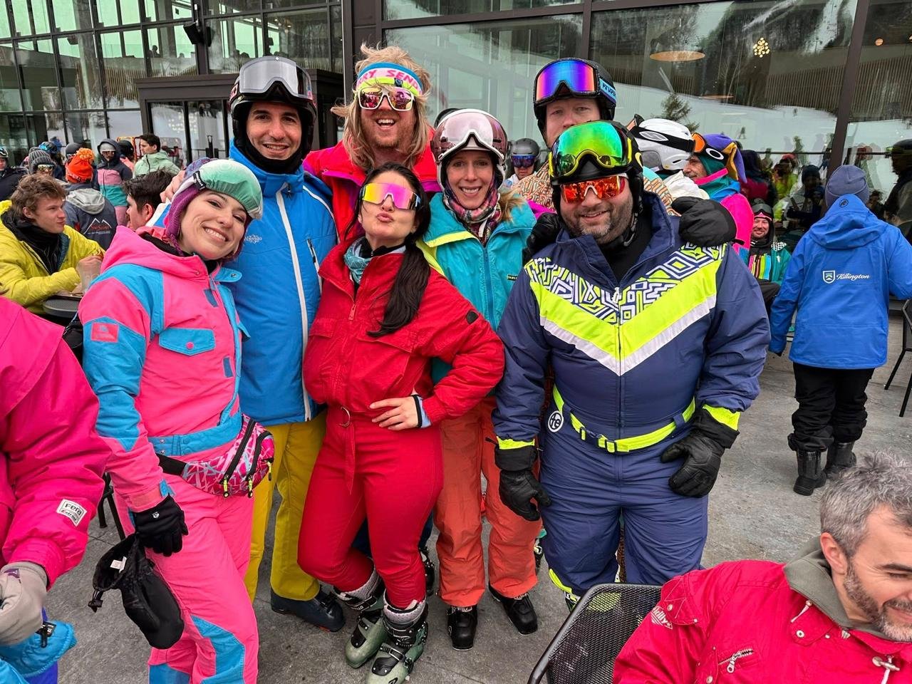 Skiers in neon one-piece suits at Killington Resort 80s Weekend costume contest