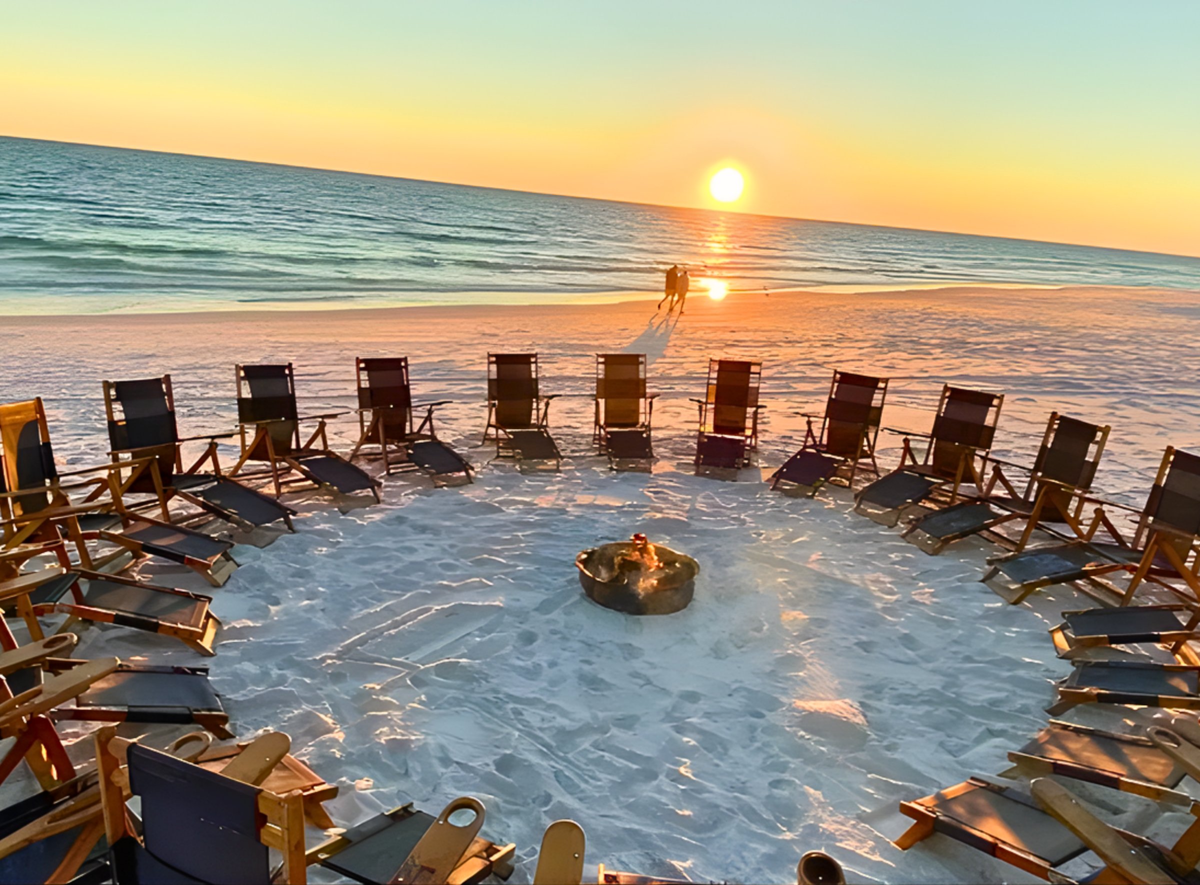 Free beach bonfire at The Royal Palm Grille with families enjoying sunset