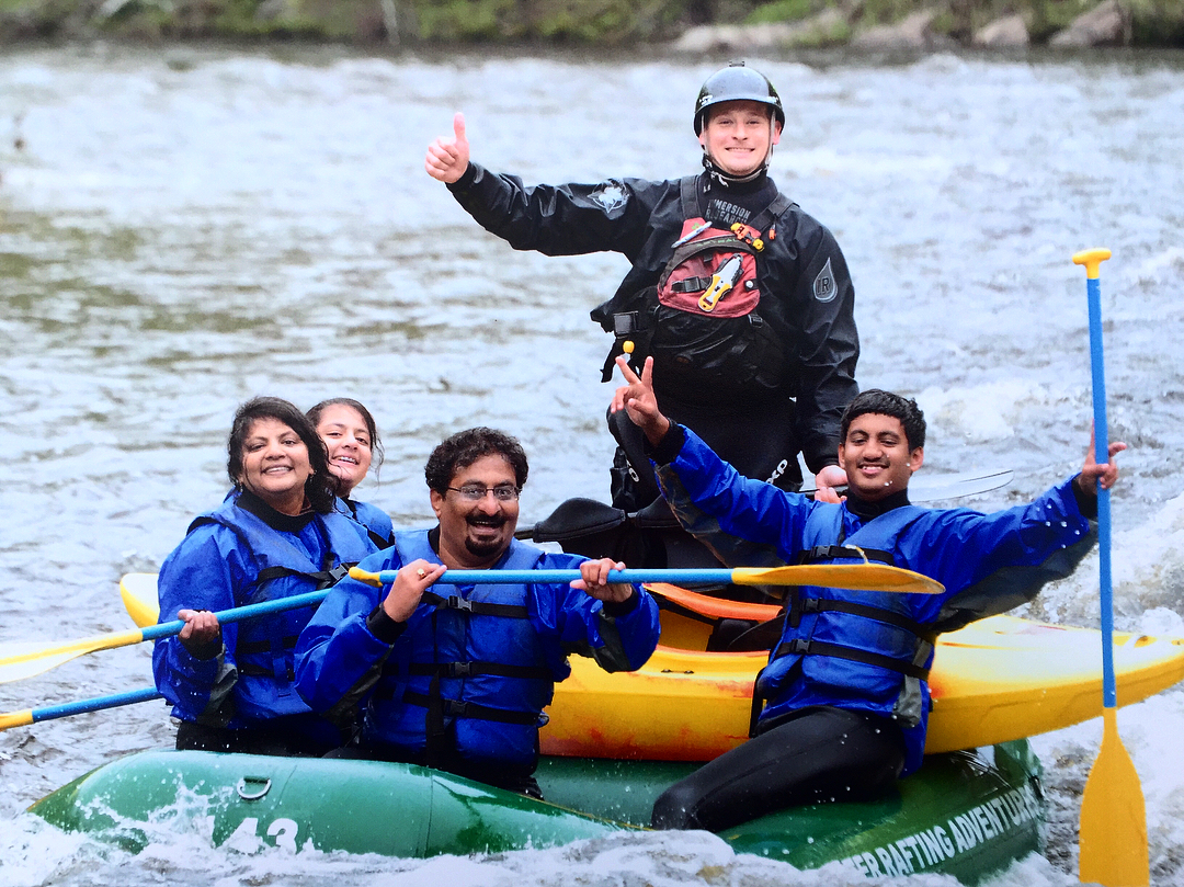 Individuals enjoying Whitewater Rafting Adventures