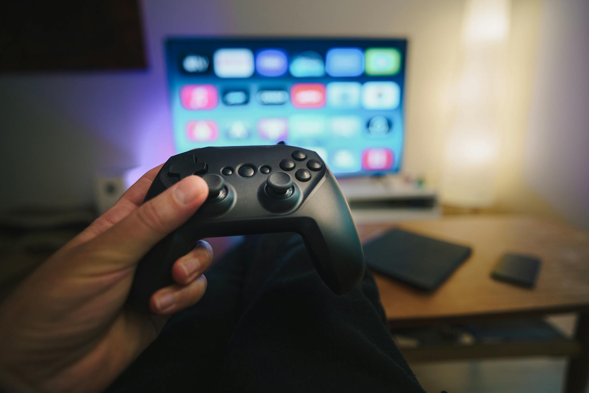 A gaming controller and a flatscreen tv