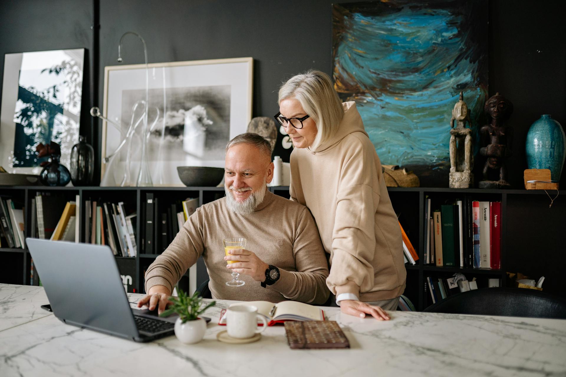 A couple viewing a laptop