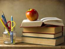 An apple on a stack of books, something you won't see on your poconos summer vacation