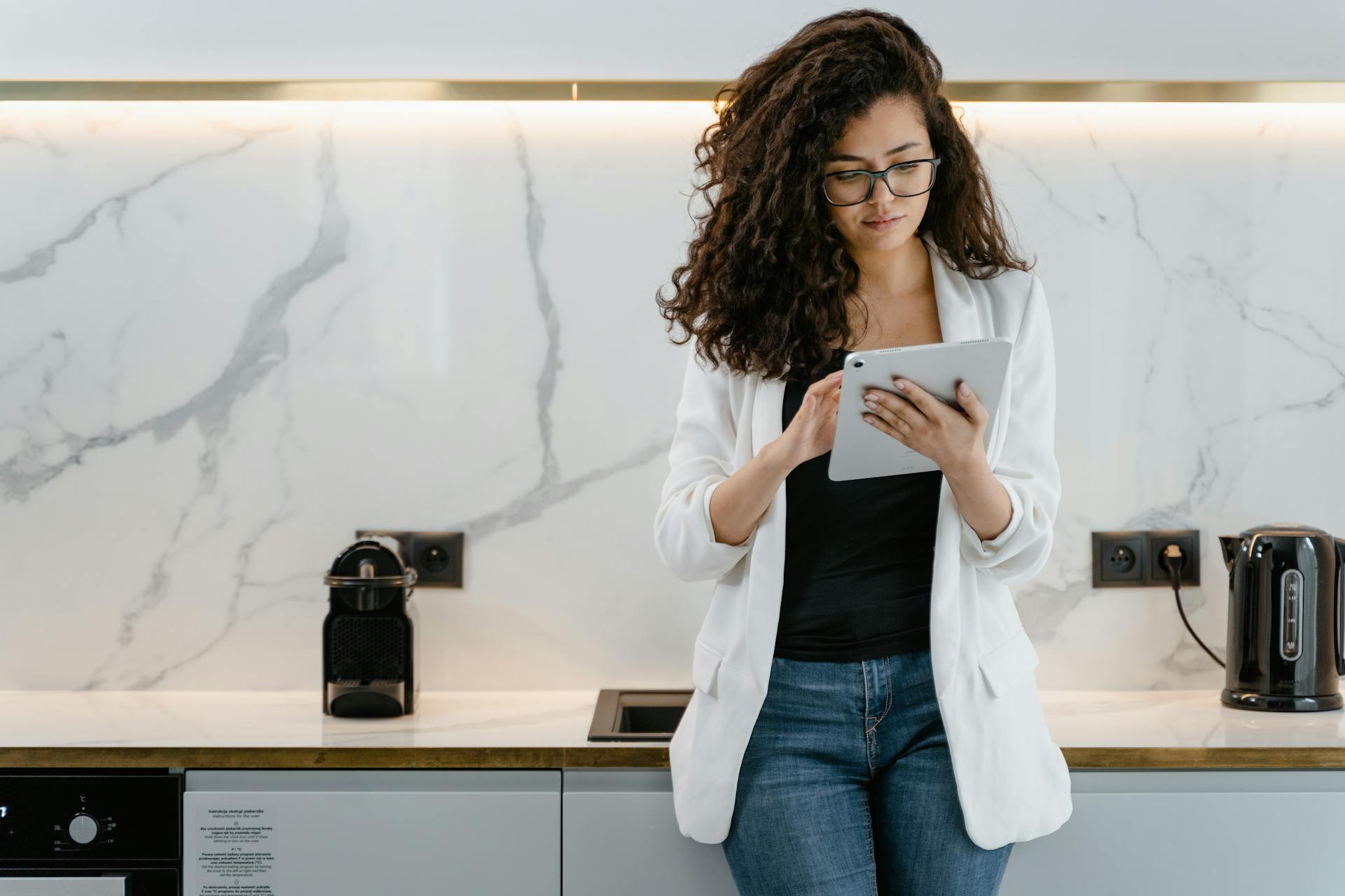 A person scrolling on a tablet