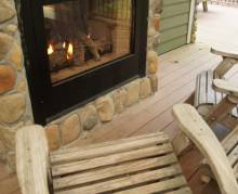 The comfortable outdoor fireplace of a winter getaway in the poconos