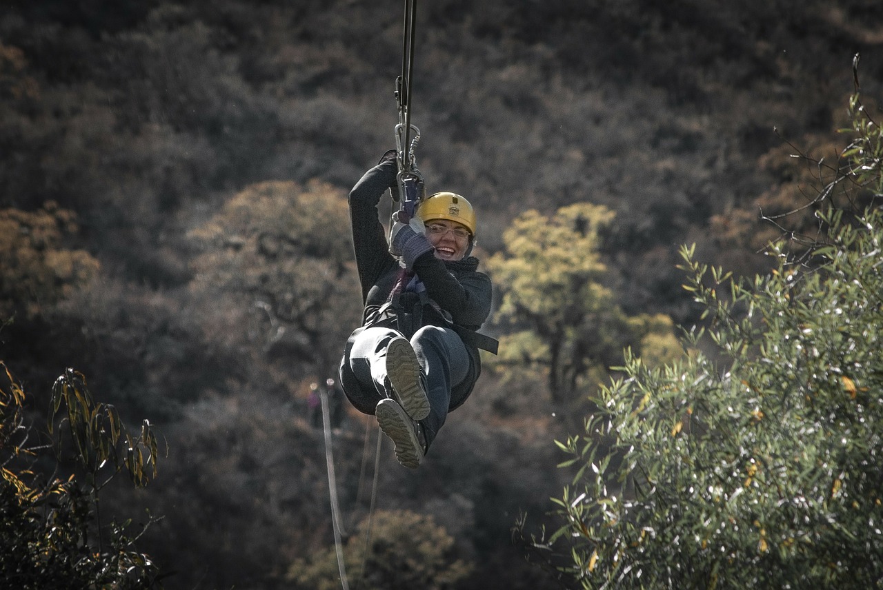 A woman having a blast ziplining at Camelback Mountain Adventures