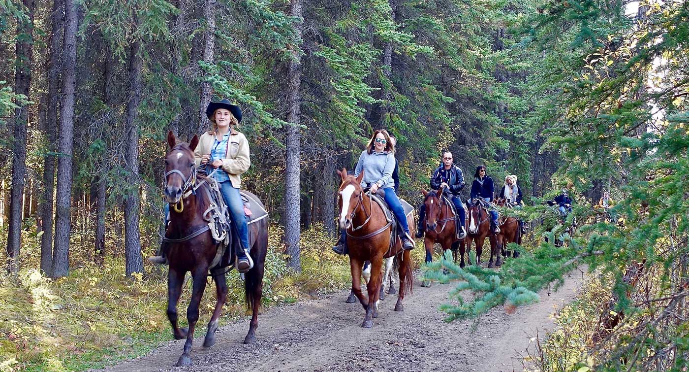 A family enjoying horseback riding in the Poconos