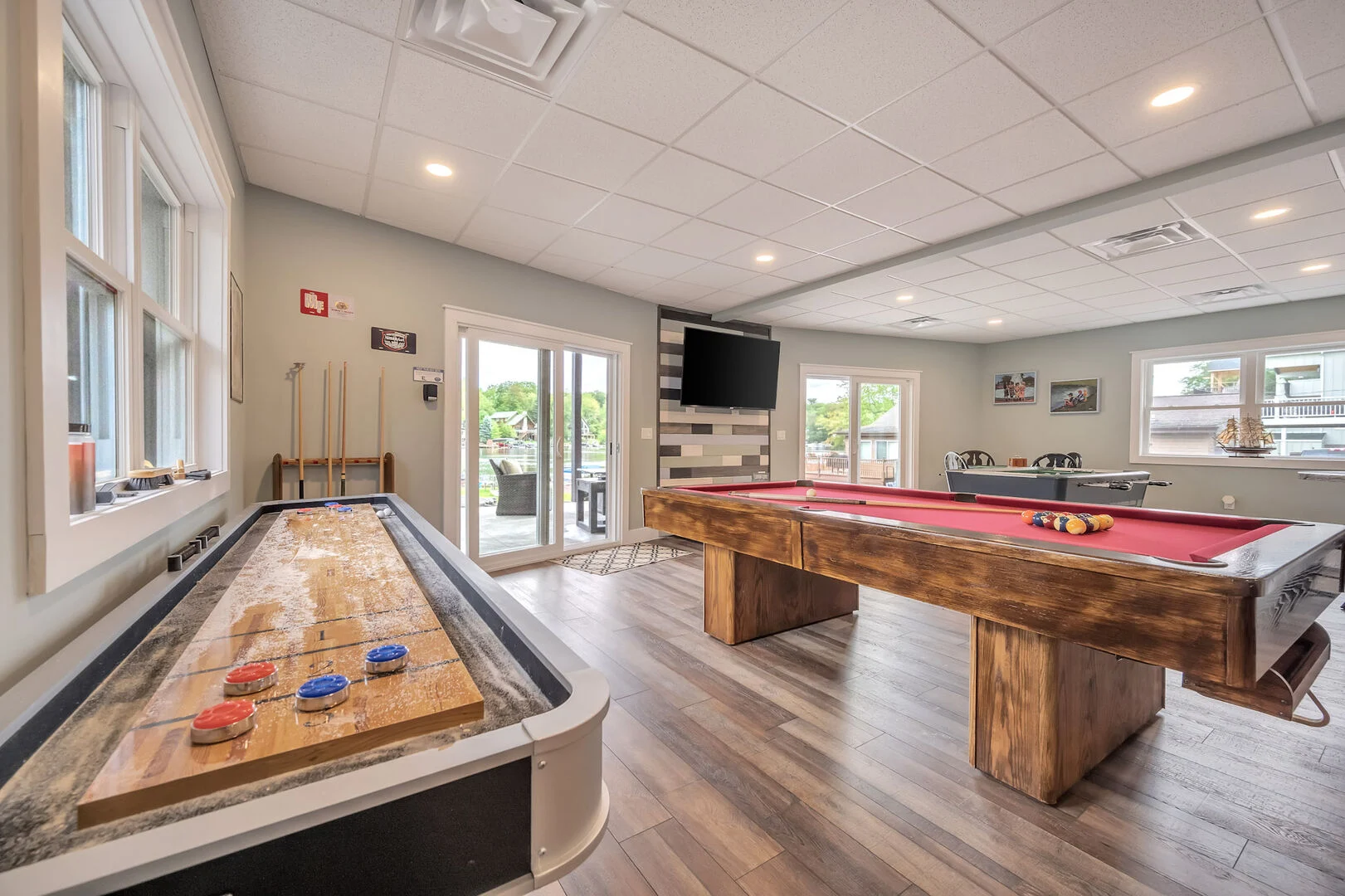 Room with pool table and shuffle board