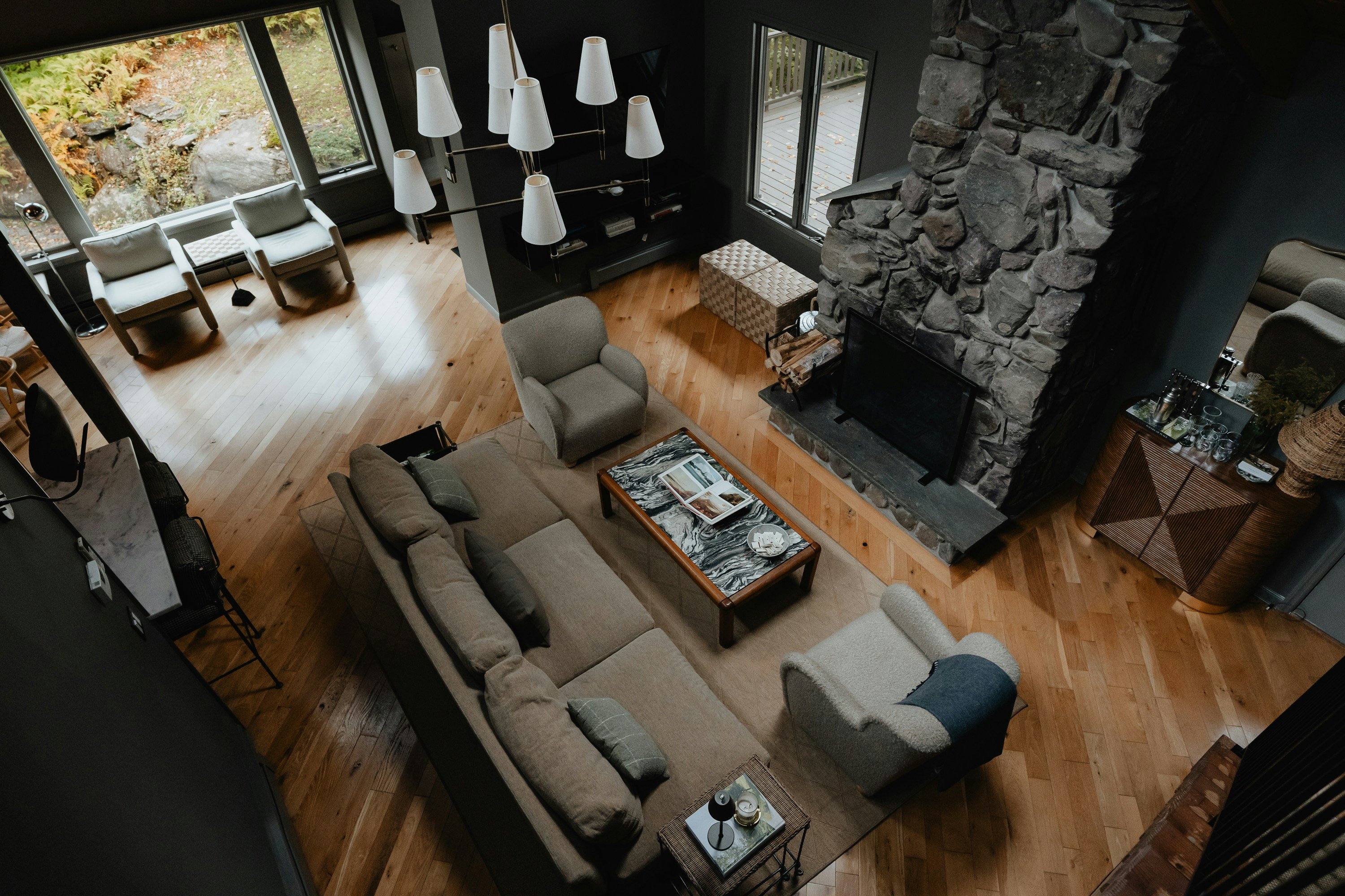 Spacious cabin living room with stone fireplace