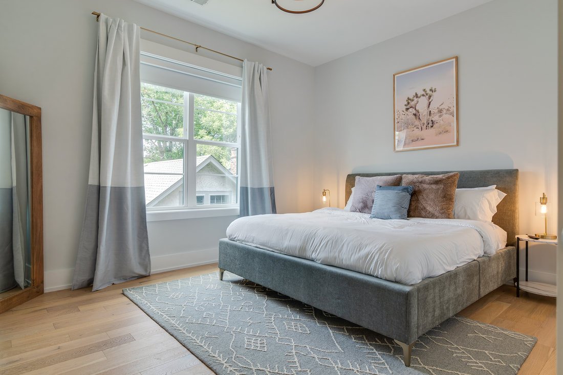 The Burch bedroom with king-sized bed and walk-in closet