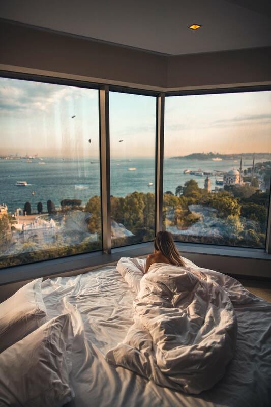 Airbnb on the water overlooking a bay in a luxury bed in a short term rental