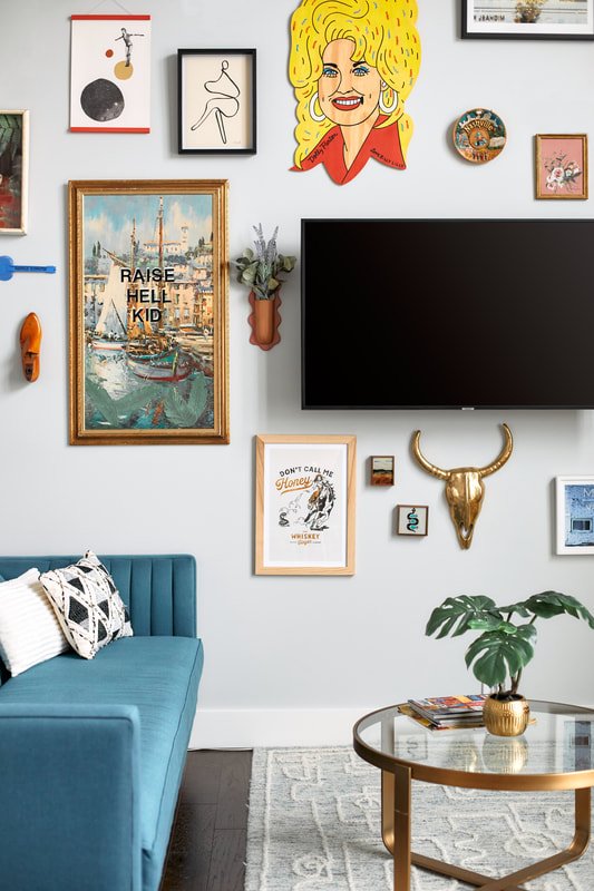 Maximalist decor detail with eclectic art and decorative objects