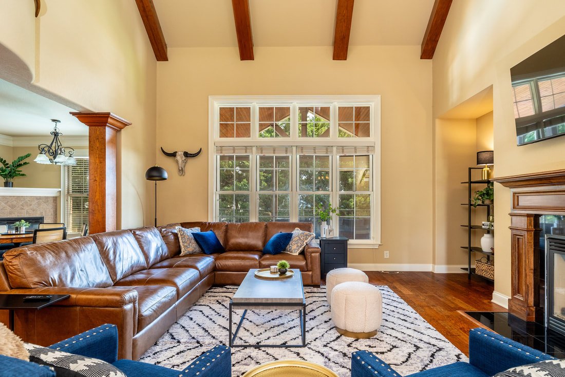 Spacious great room with vaulted ceilings and dual electric fireplaces