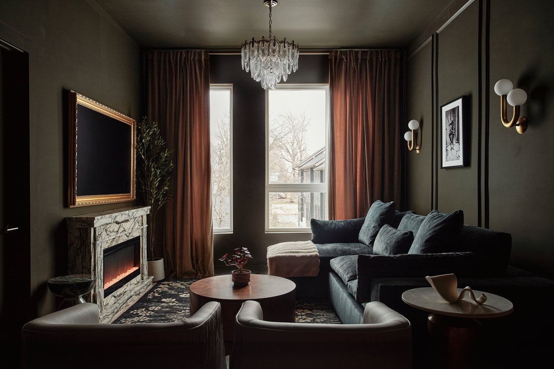 The Maren living room with designer lighting and electric fireplace