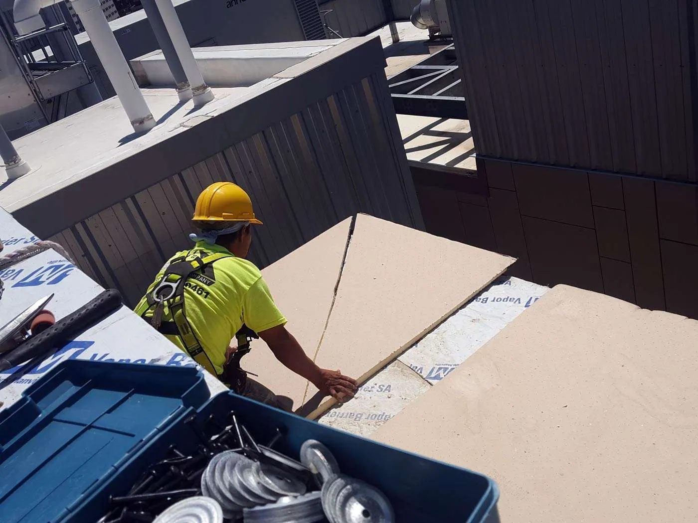 WAZE installing a cover board on a flat roof