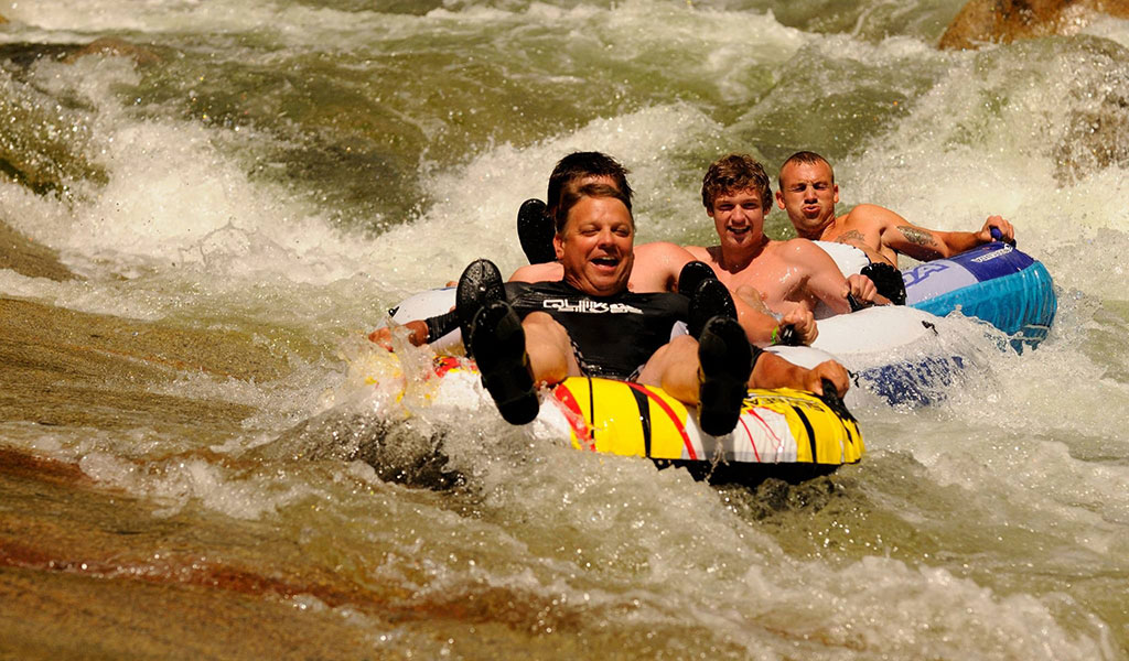 Friends enjoying the river on innertubes near Wawona