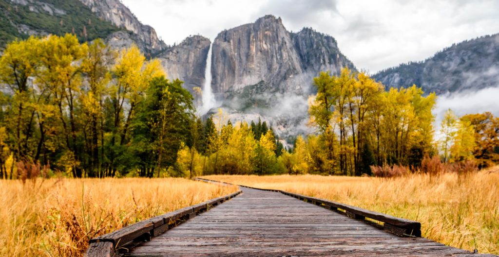 Boardwalk with a view of Yosemite Falls in Yosemite Valley