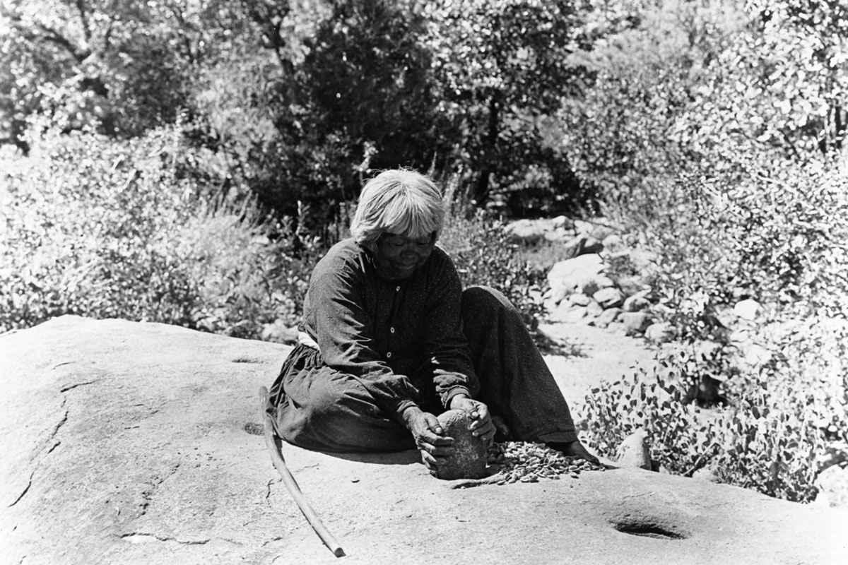 Lucy Brown pounding acorns