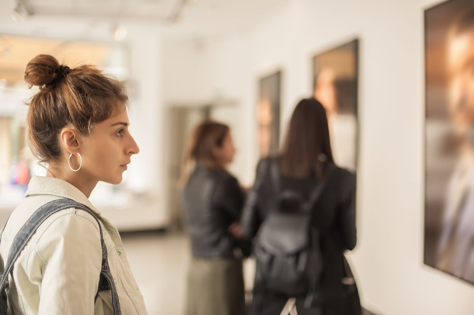 woman looking at art