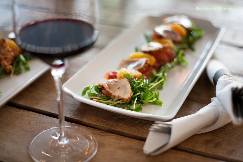 Wine and seafood dinner on a table at a waterfront restaurant