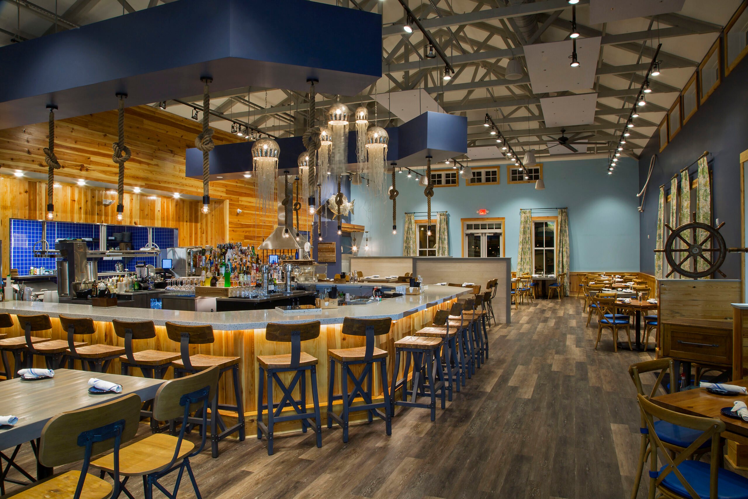 Nautical-themed restaurant interior with a large bar