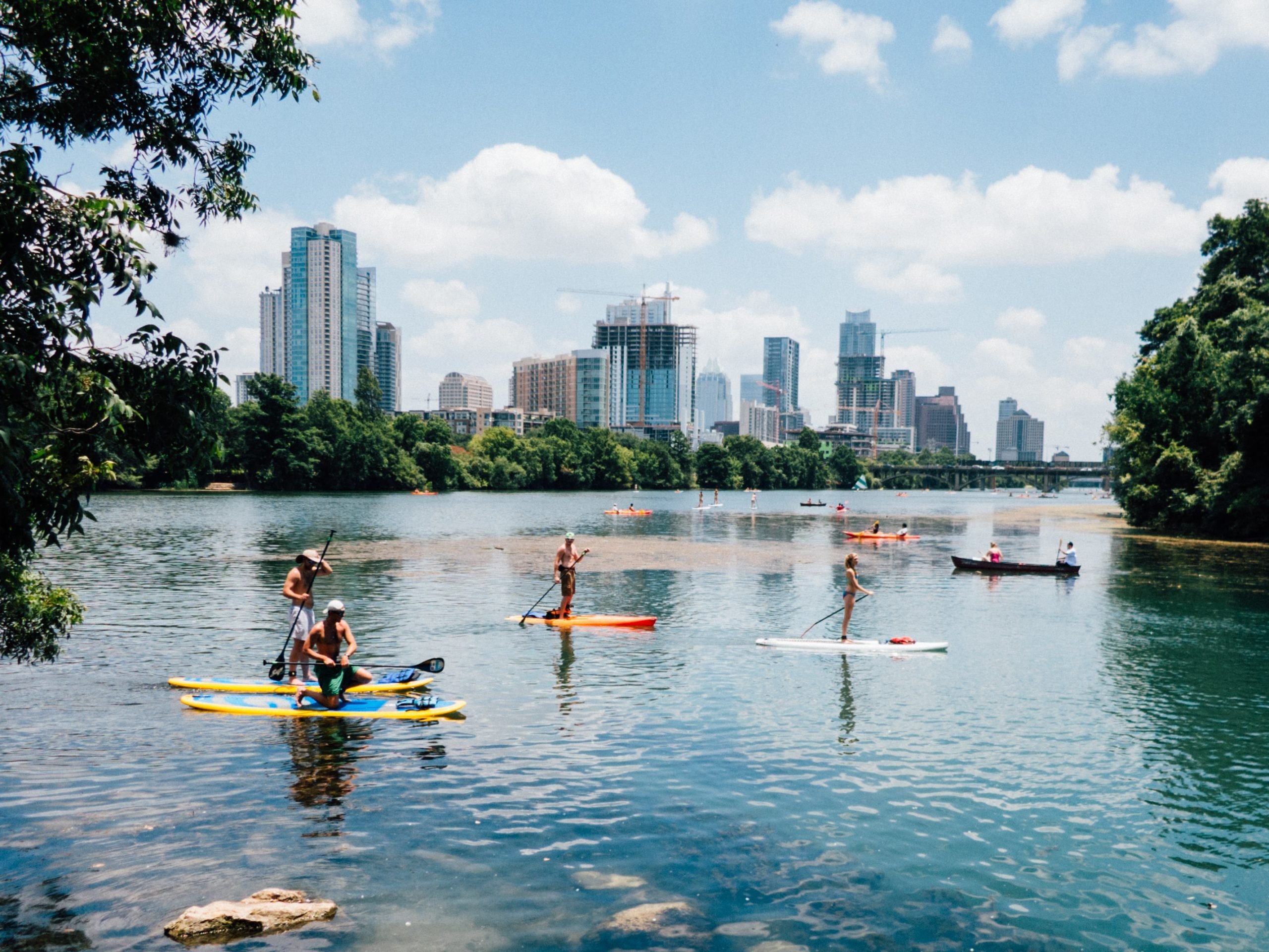 Paddleboarding on Lady Bird Lake with the Austin skyline