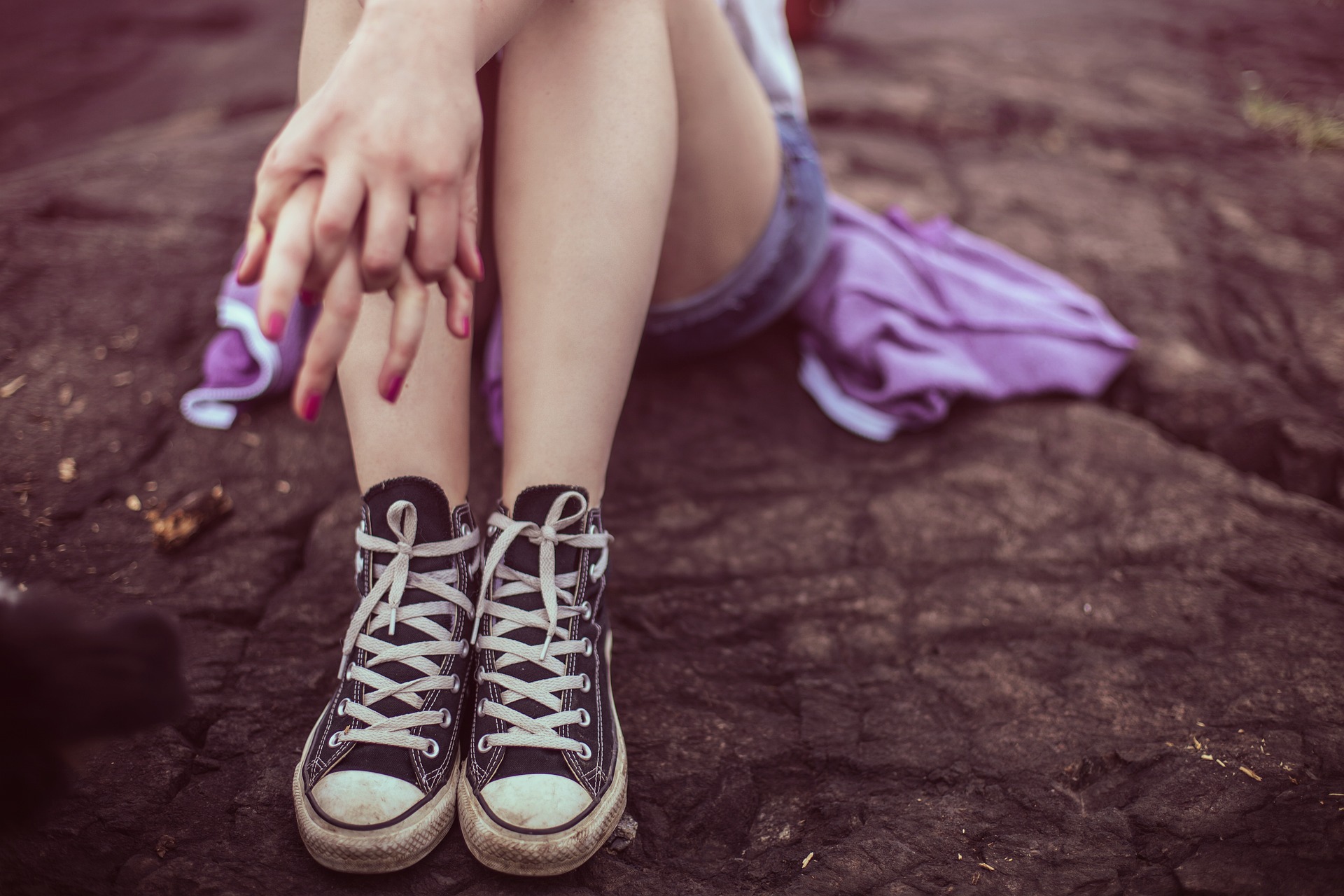 person legs with canvas shoes