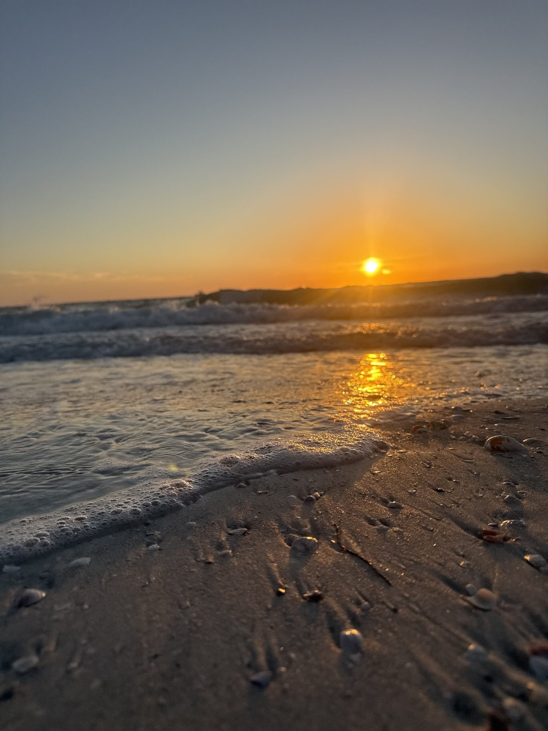 Clear turquoise Gulf water and white sand at Pass-a-Grille Beach, Florida