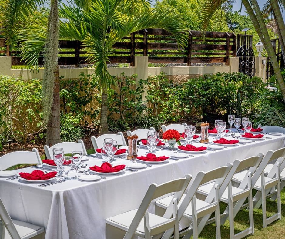 Table set up for lunch on the lawn on Mais Oui Villa in Discovery Bay Jamaica, a gated and secure property