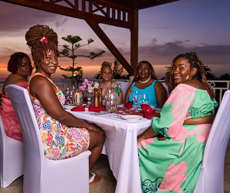 Group of friends having dinner at Mais Oui Villa in Discovery Bay Jamaica