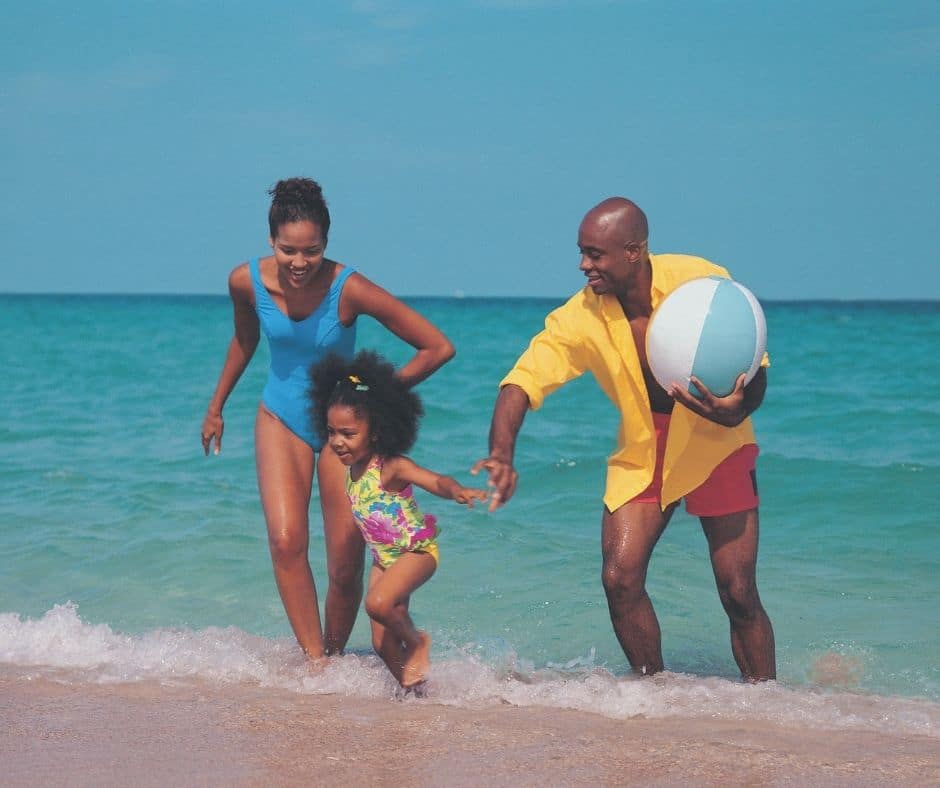 Family at the beach celebrating Boxing Day in Jamaica