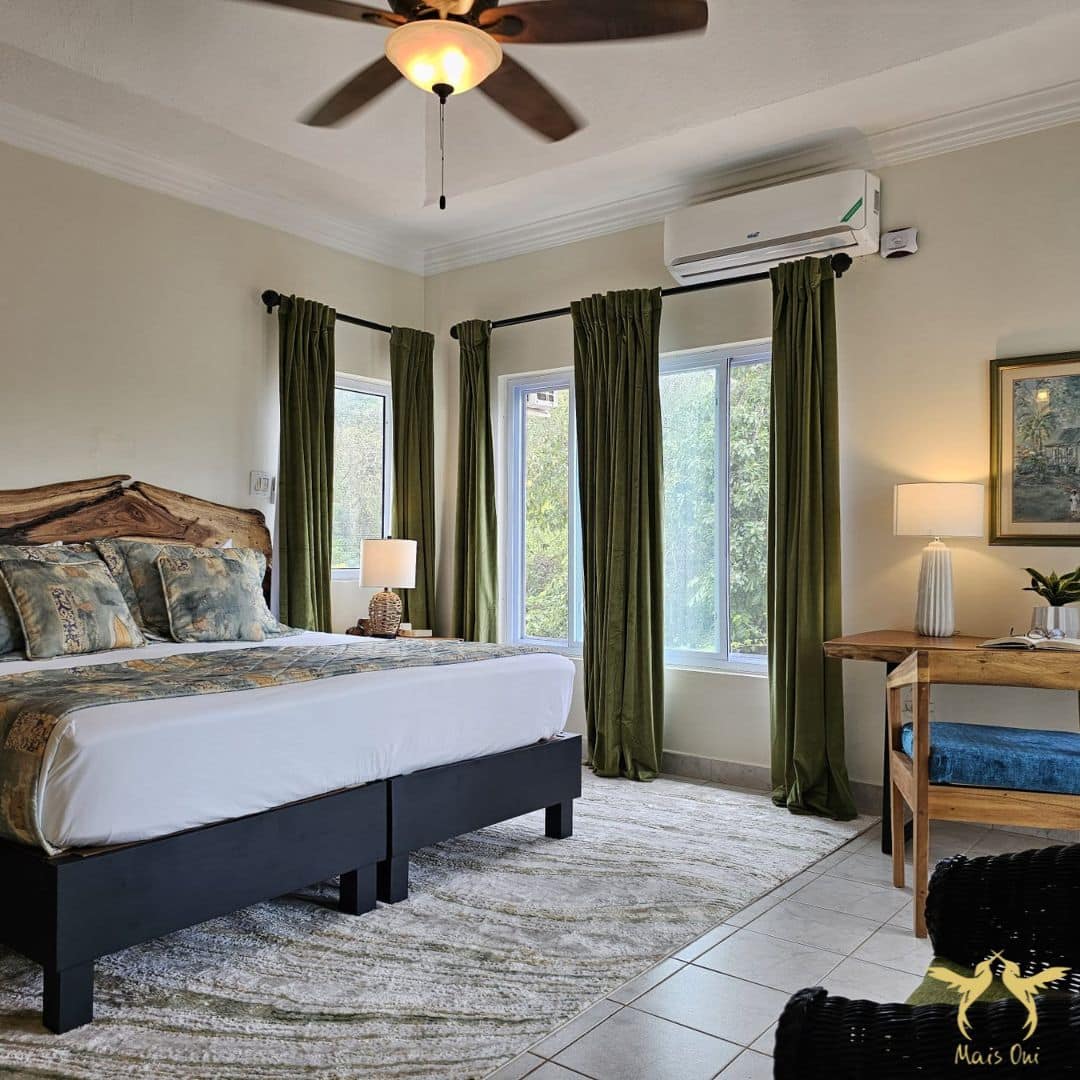 Jamaica villa rental bedroom - bedroom at Mais Oui Villa in Discovery Bay Jamaica with luxury linens and custom made furniture by a local wood artist