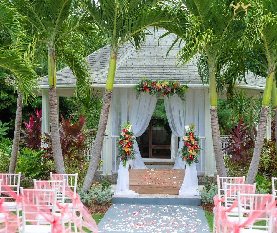 Gazebo in the garden with tropical flowers at villa in Discovery Bay Jamaica