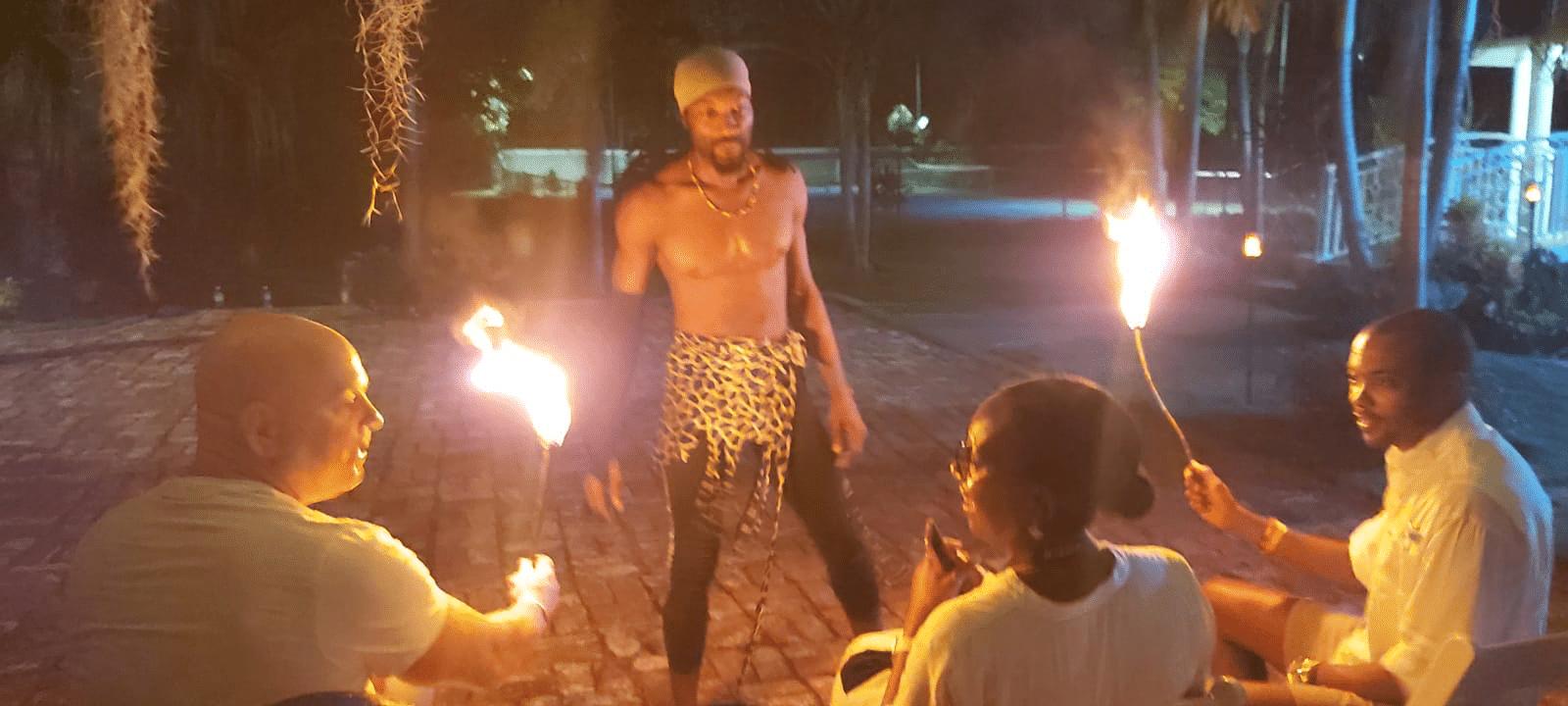 fire dancer performance at party for wedding anniversary in Jamaica at Mais Oui Villa in Jamaica
