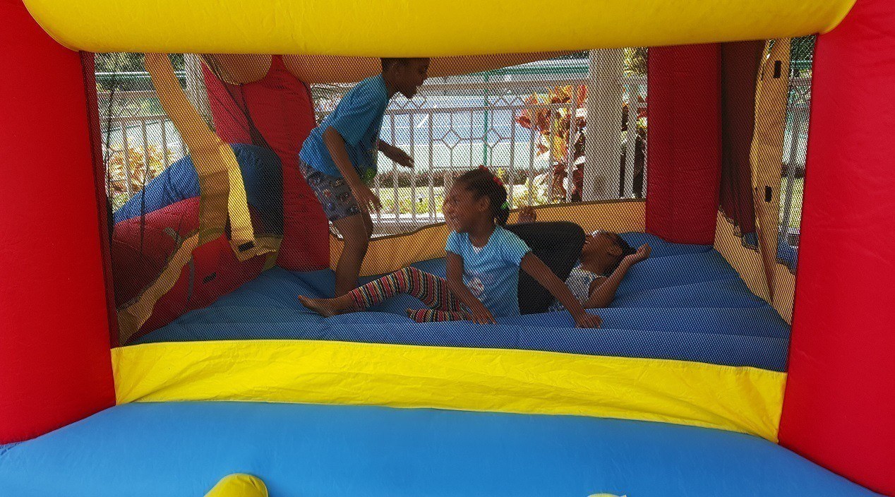 bouncy house with children playing - one of the amenities at the Jamaica villa rental Mais Oui Villa