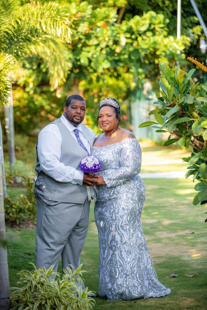 wedding couple in a beautiful garden at a Jamaica wedding venue Mais Oui Villa