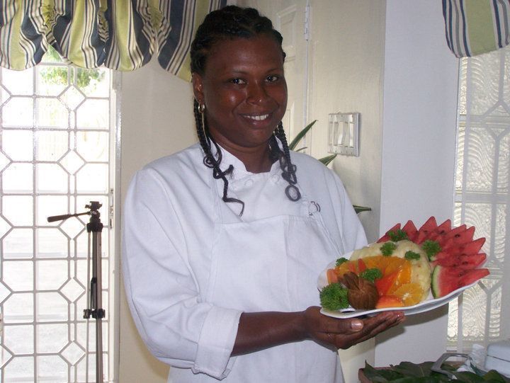 staff at Jamaica villa rental holding a fruit platter