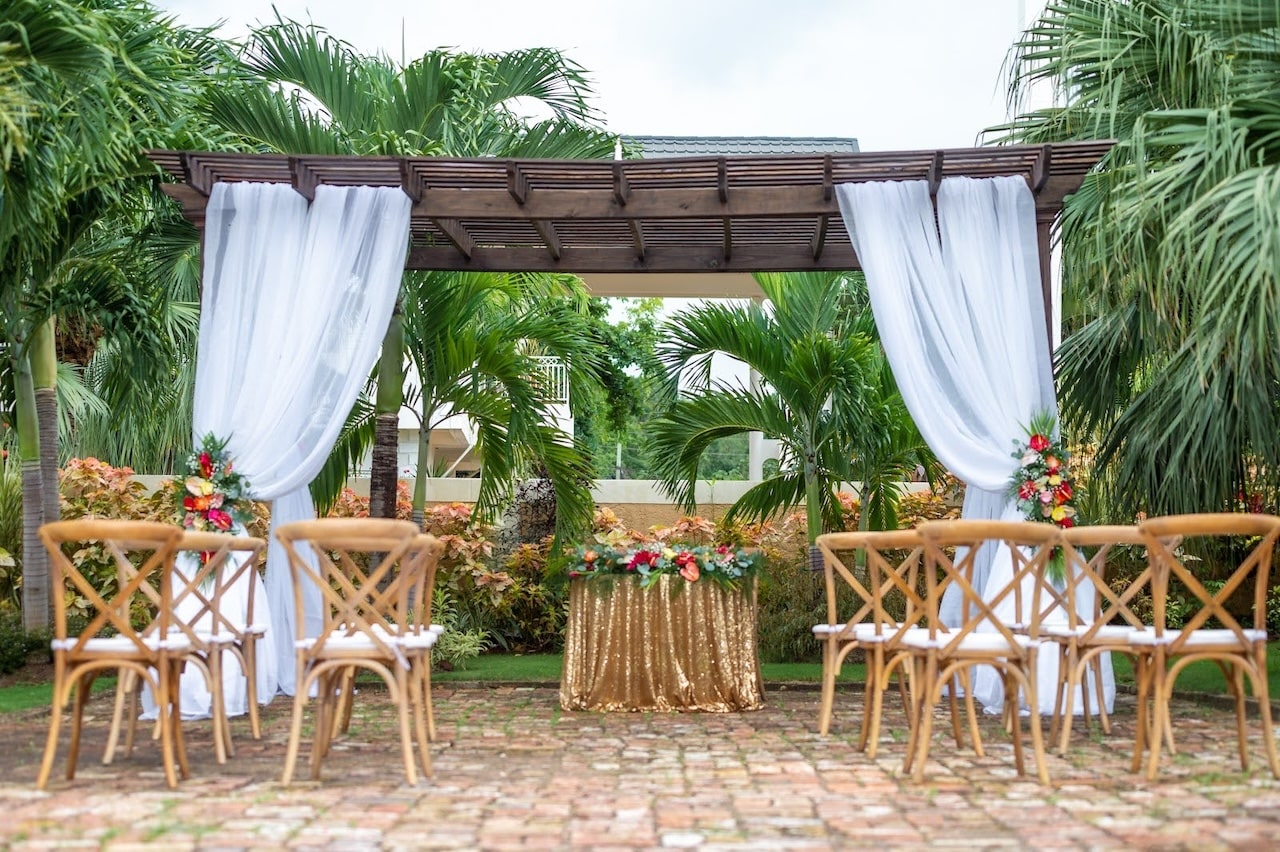 Jamaica wedding venue at Mais Oui Villa in discovery Bay - wooden trellis on historic brick patio