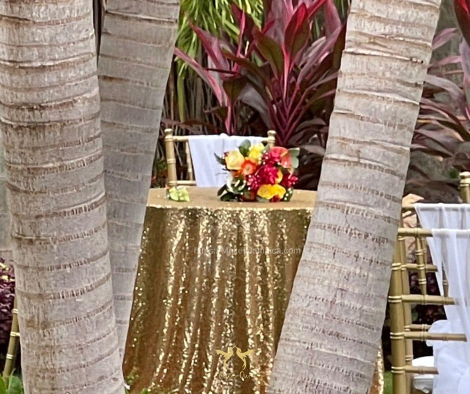 Table with bridal bouquet at a garden wedding in Jamaica at Mais Oui Villa in Discovery Bay for a couple eloping to Jamaica
