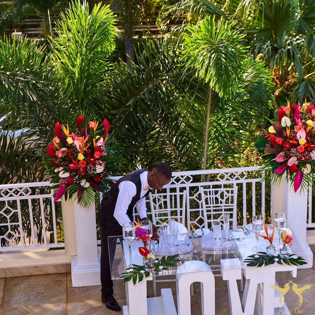 Butler setting up for a small wedding at Mais Oui Villa in Discovery Bay Jamaica - a villa rental and Jamaica wedding venue in one