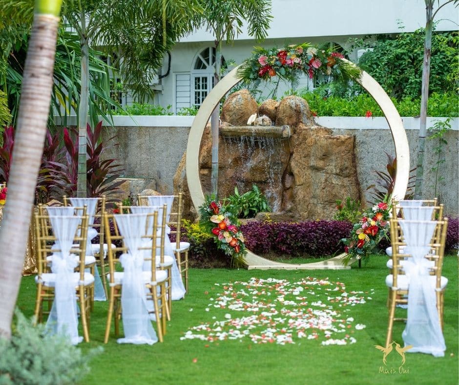 Wedding arch and chairs set up in a garden when you book a wedding through Airbnb