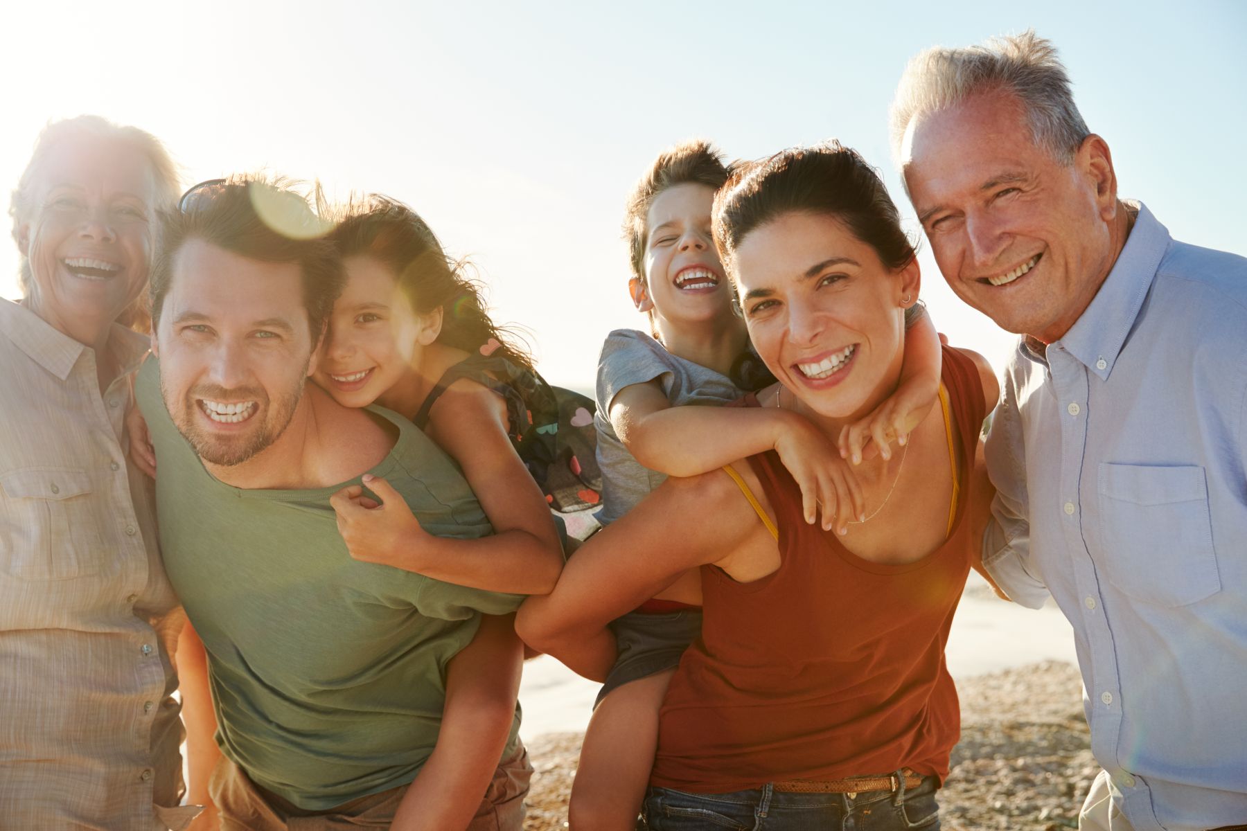family posing on beach