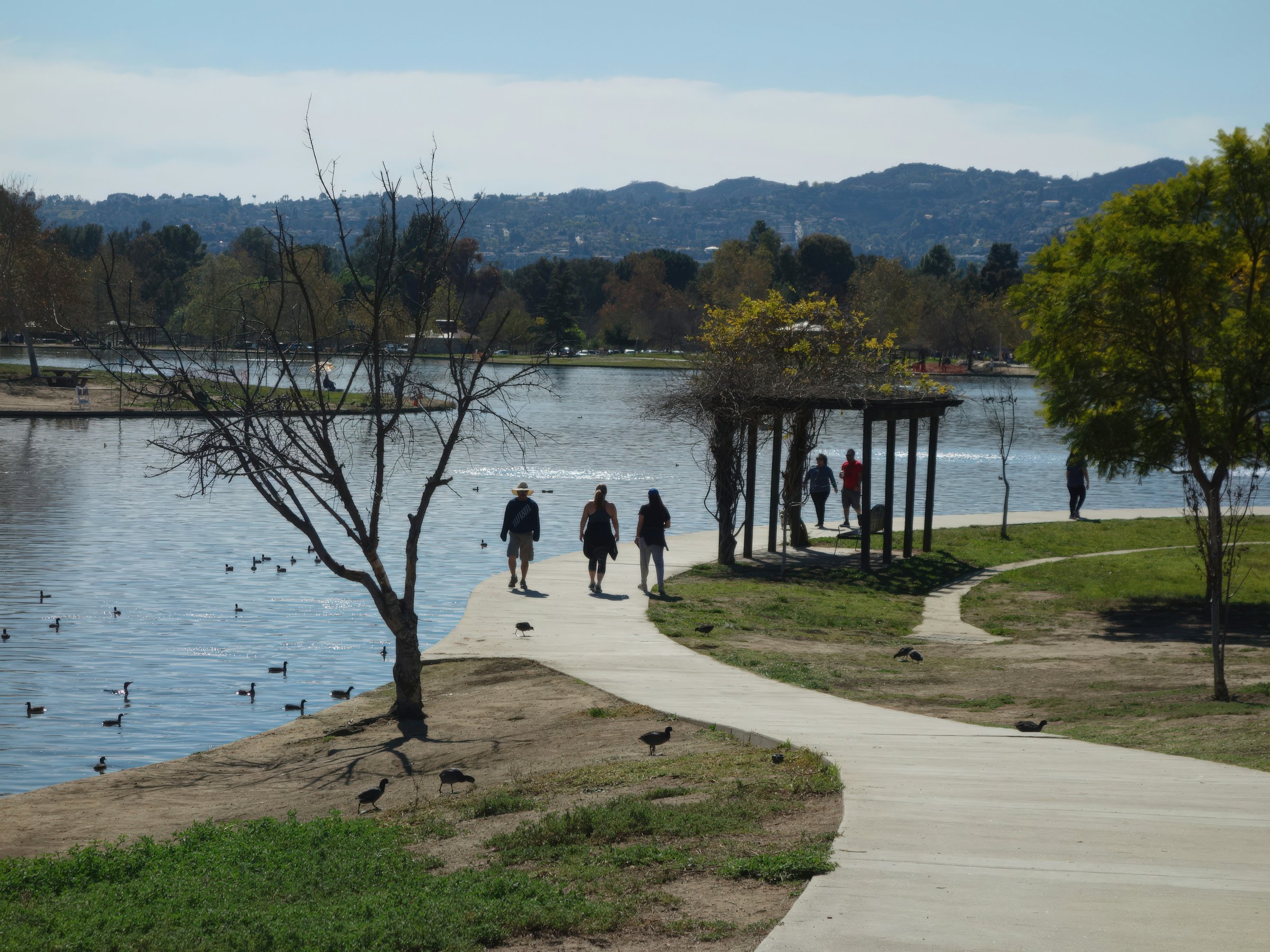 Atascadero Lake Park in California with the walking path around the lake and the playground in the background