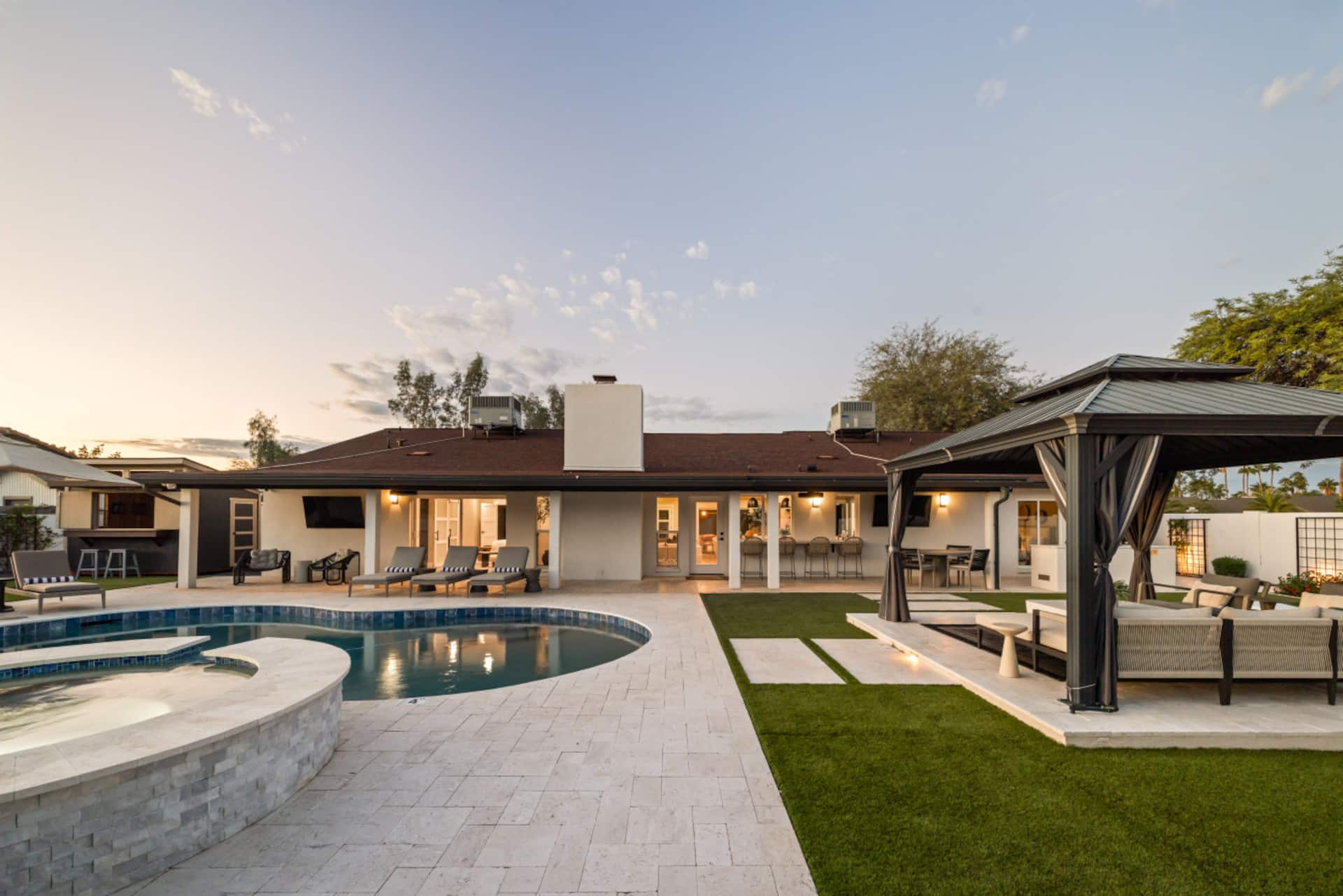 Heated pool and covered outdoor lounge at the Scottsdale Clubhouse