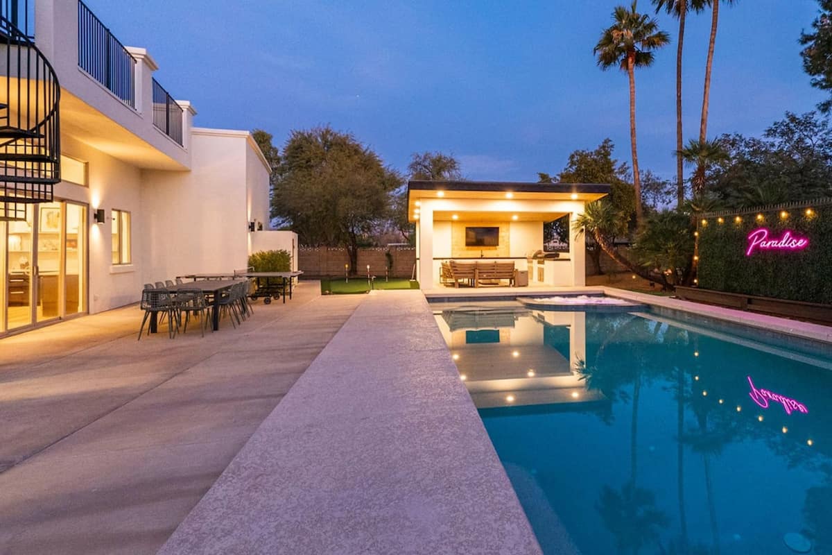 Paradise Villa pool and outdoor entertaining area at dusk