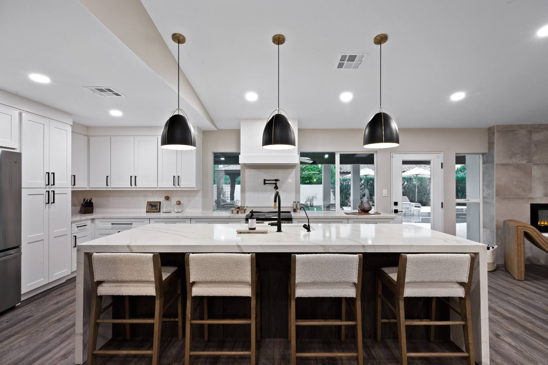 Bright chef’s kitchen with a large island and pendant lighting