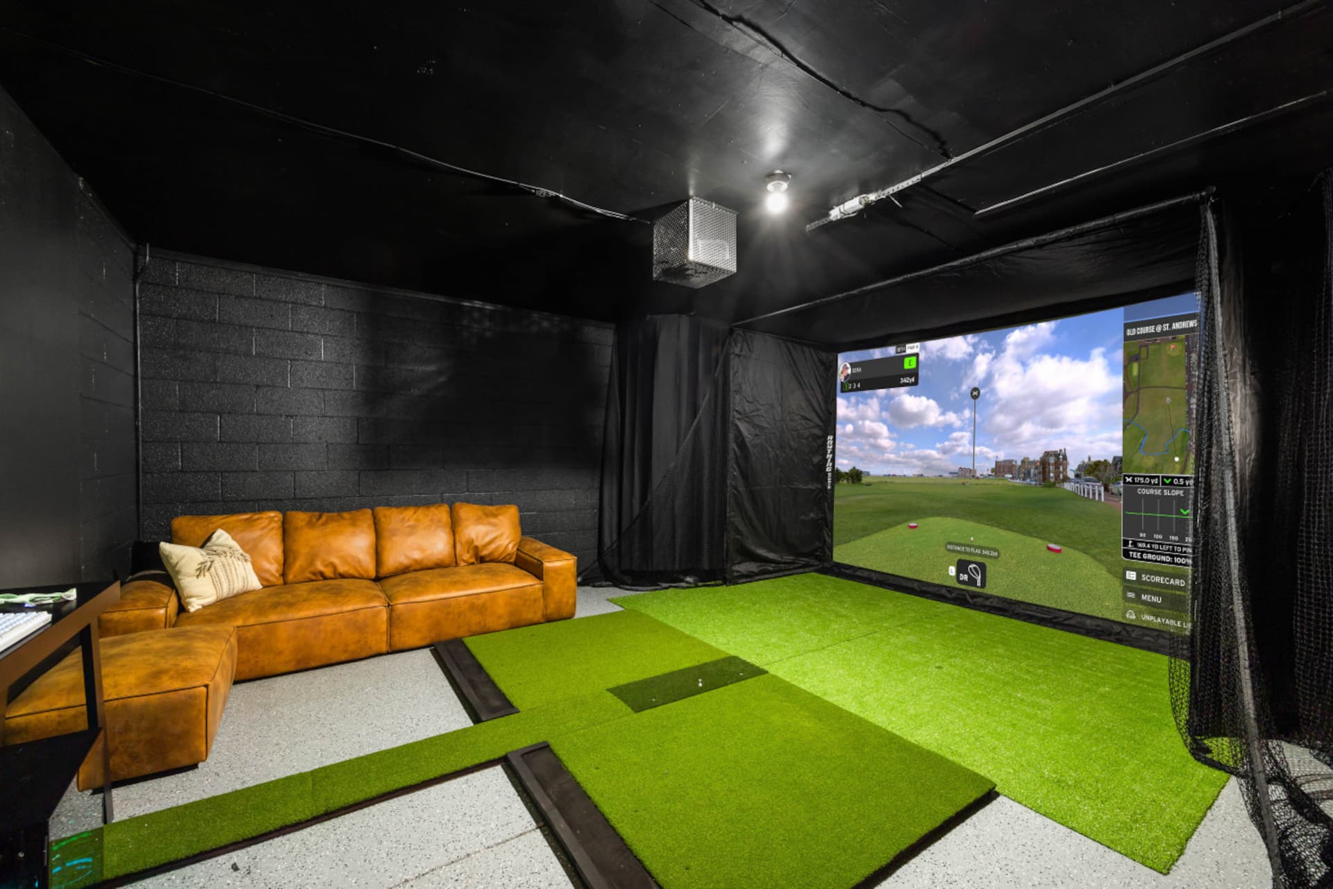 Private indoor golf simulator and arcade room