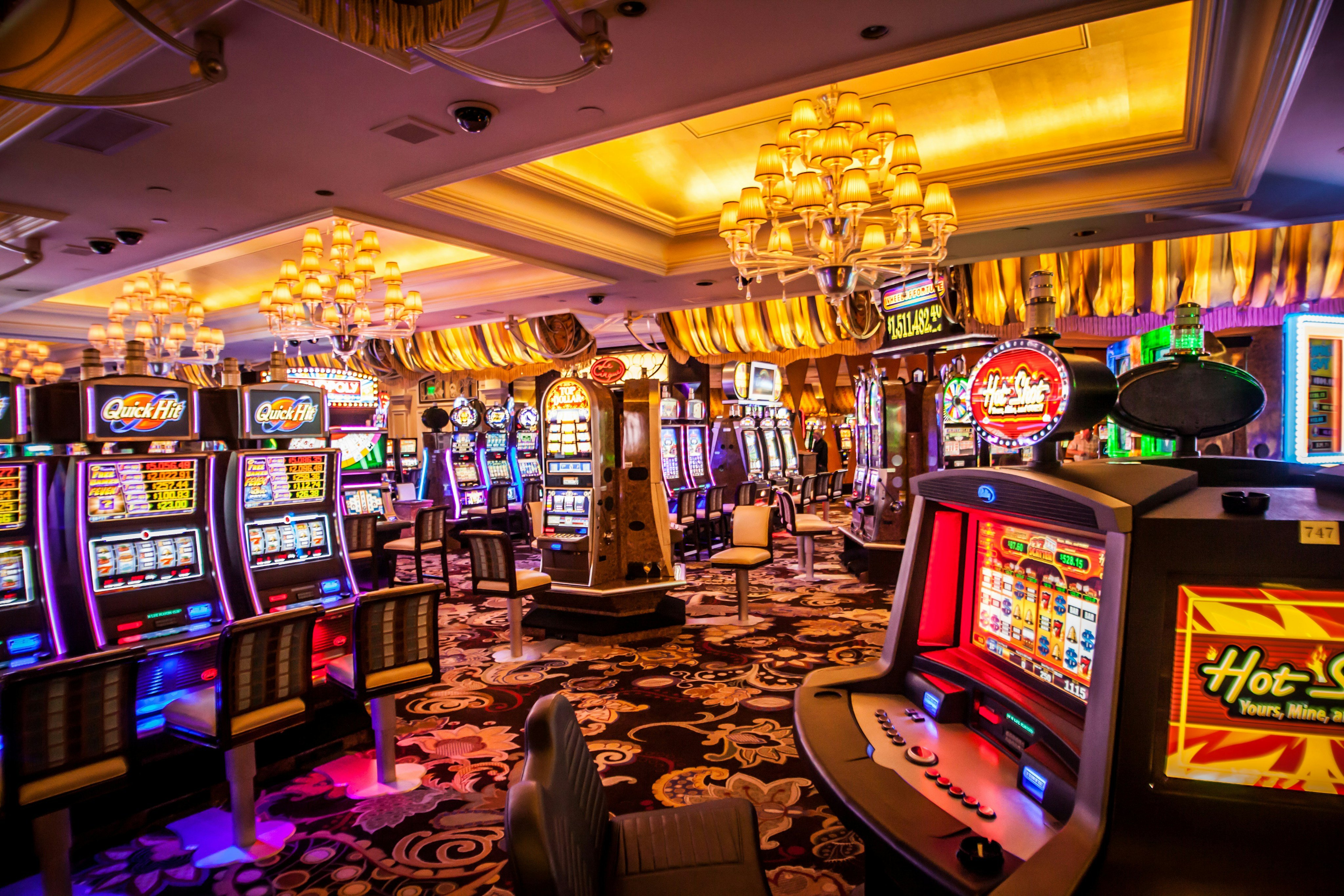 Casino floor with slot machines and warm lighting