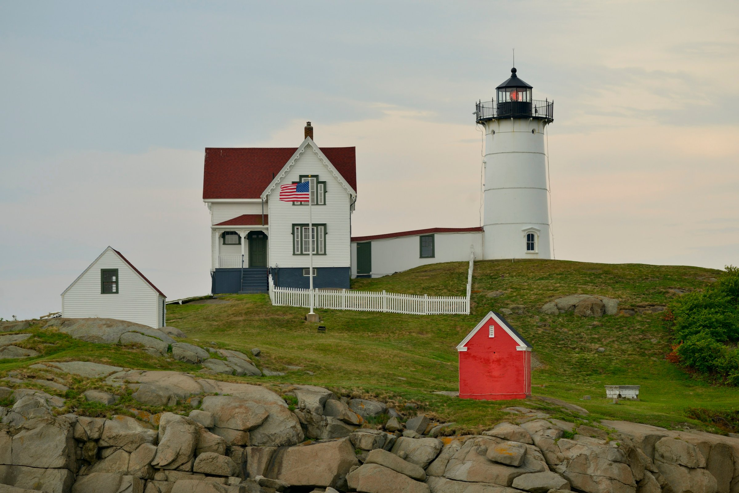 Cape Neddick Light on its rocky islet seen from Sohier Park in York, Maine, with the white keeper's house beside the tower