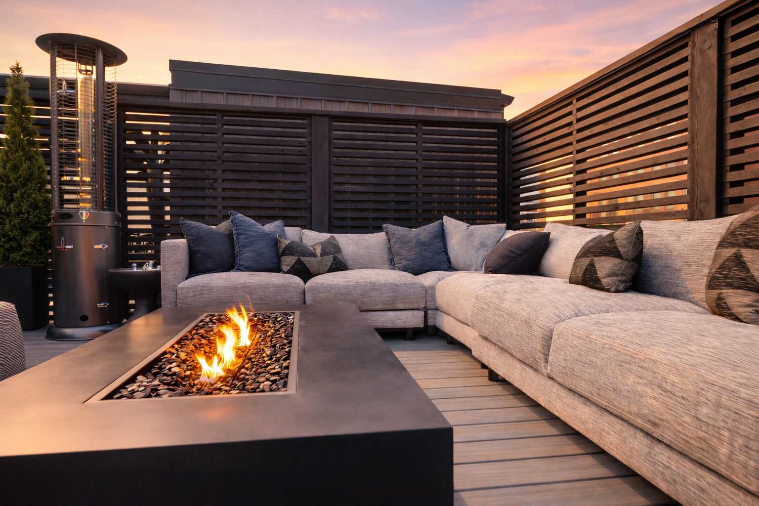 rooftop patio with firepit and seating overlooking city skyline for short term rental