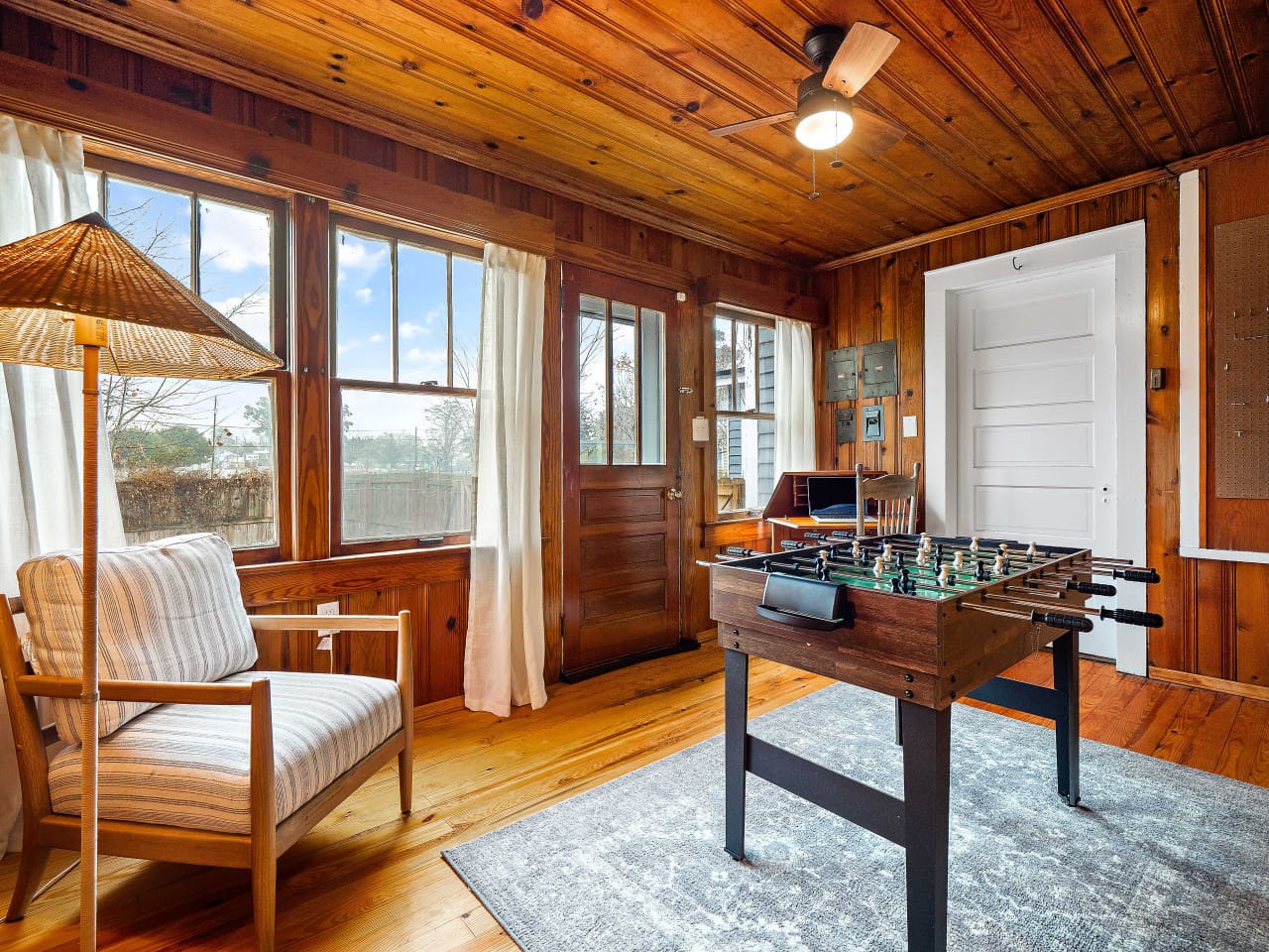 Inviting Game Room with Foosball Table and Forest Views
